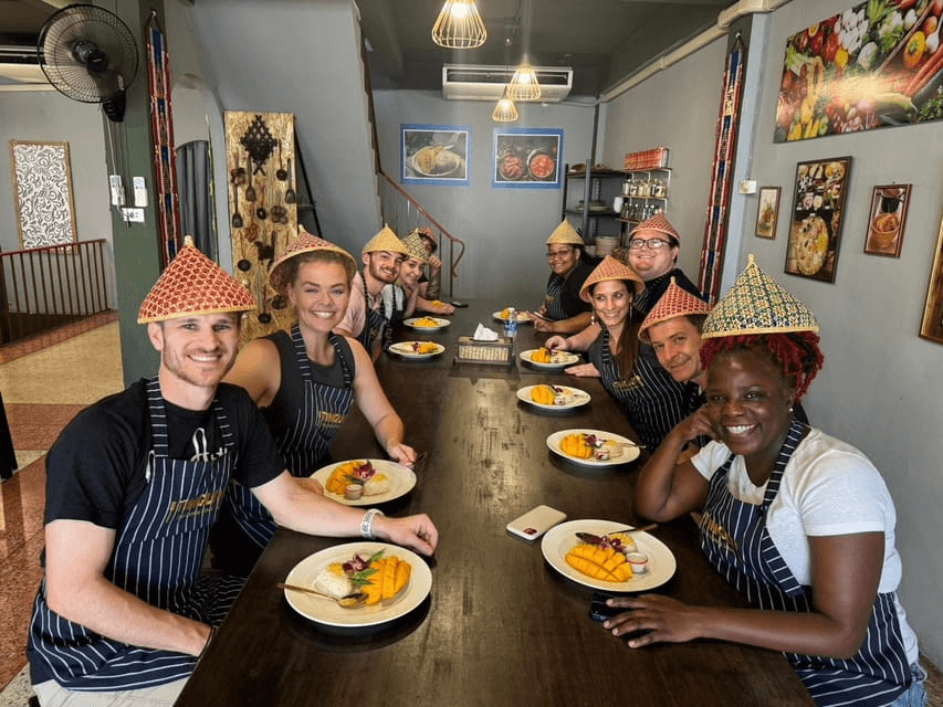 Students enjoying a hands-on lesson during one of the Best Thai Cooking Classes in Bangkok