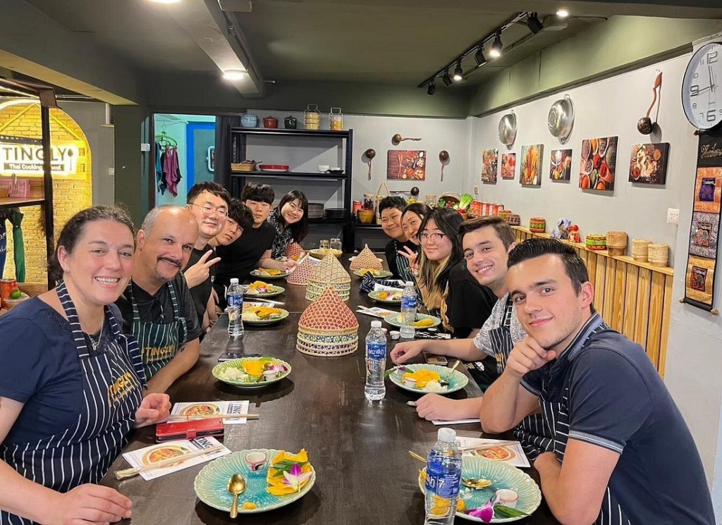 Cooking class group enjoying their meal after one of the Best Thai Cooking Classes in Bangkok