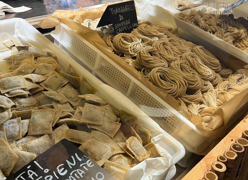 Selection of fresh handmade pasta including ravioli and tonnarelli on rome market tours at a local Rome food market