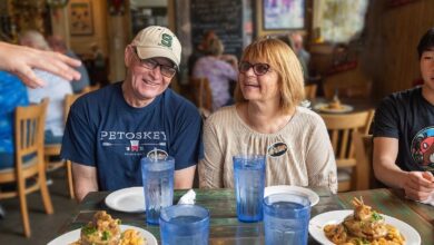 New Orleans food walking tour with guests enjoying classic Creole dishes inside a cozy local restaurant during a guided culinary experience.