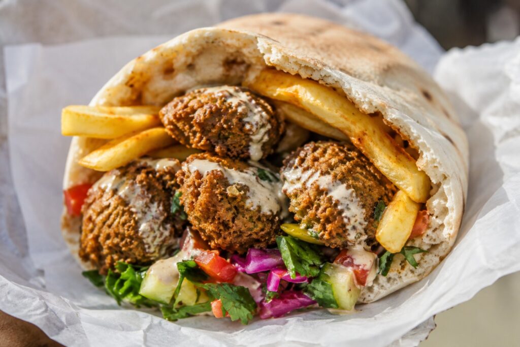 HaKosem's falafel and fries pita, the reason people wait in line.