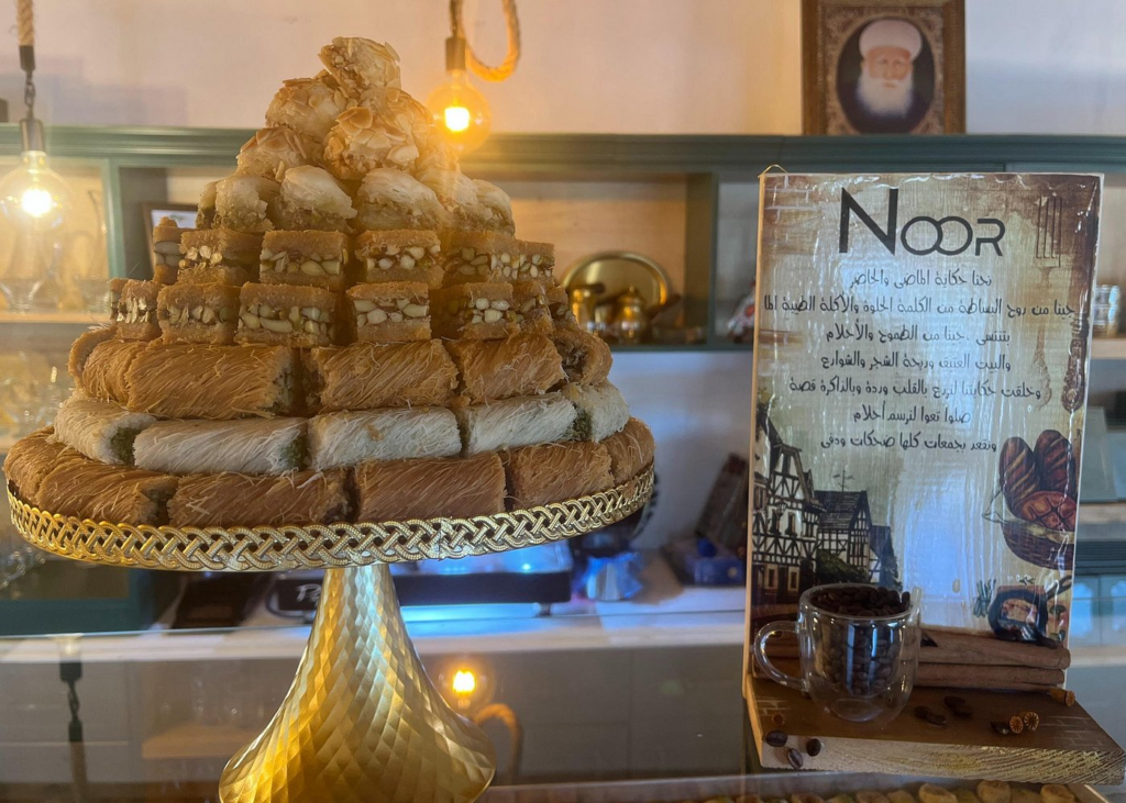 Jerusalem Food Tours showcase an elegant display of baklava, kanafeh, and traditional Middle Eastern pastries at a specialty dessert shop in Jerusalem.