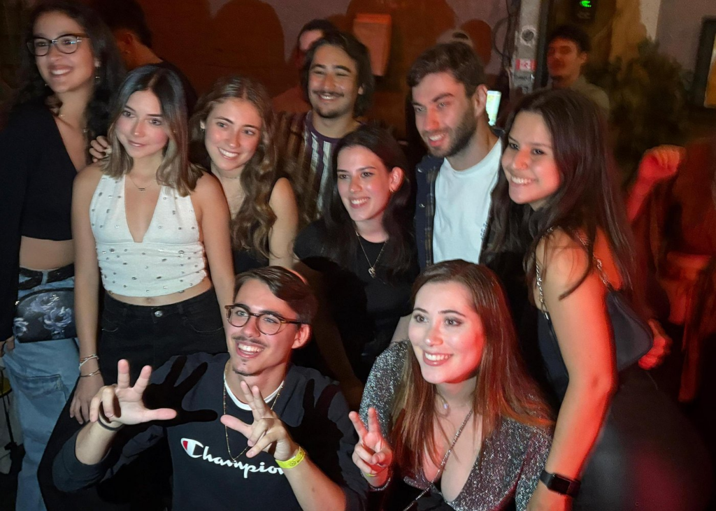 Young friends enjoying Tel Aviv's vibrant nightlife after a culinary experience on one of the best Israel food and market tours.