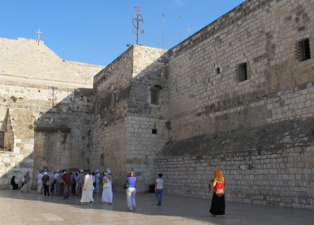 Visitors exploring the Church of the Nativity in Bethlehem, a historic cultural stop often included on Israel food and market tours.